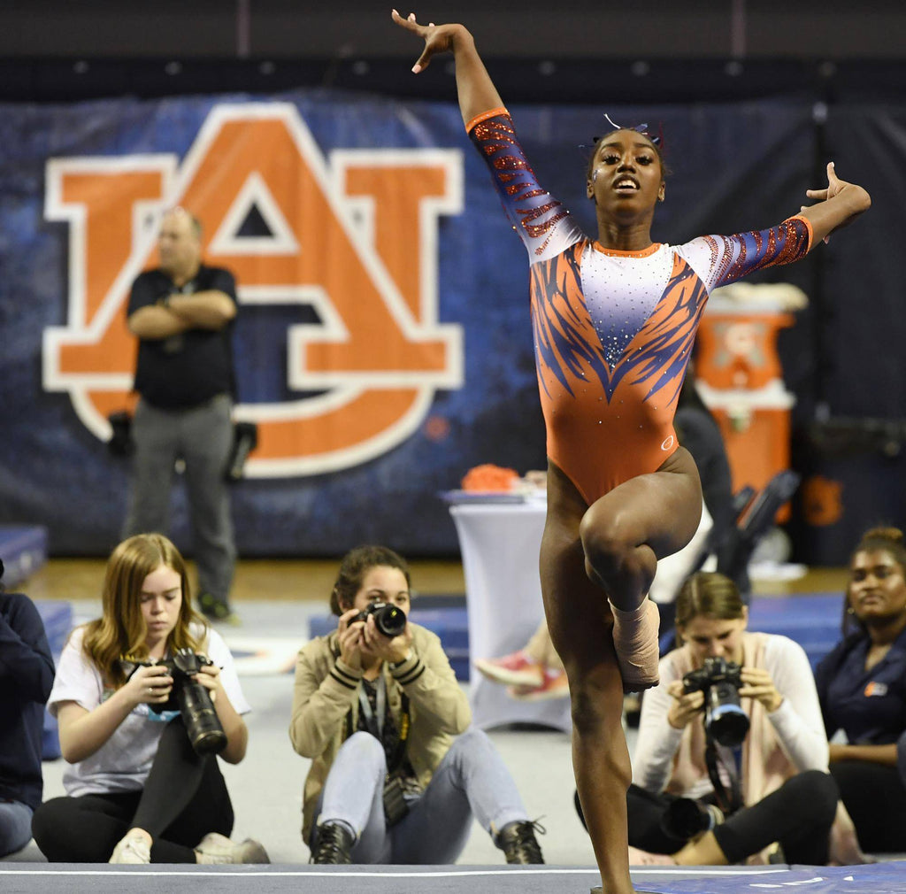 GYMNAST DERRIAN GOBOURNE PLACES AN IMAGINARY CROWN ON HERSELF ENDING THE BEYONCE ROUTINE